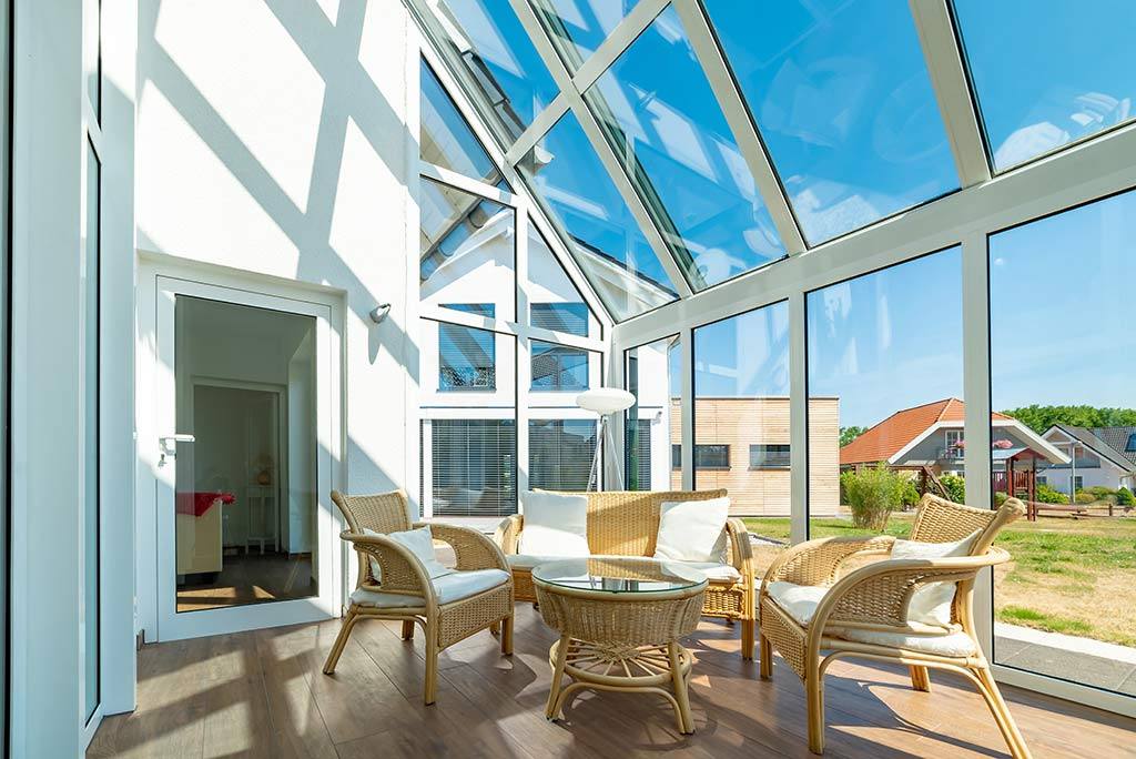 high end conservatory with a view of a garden