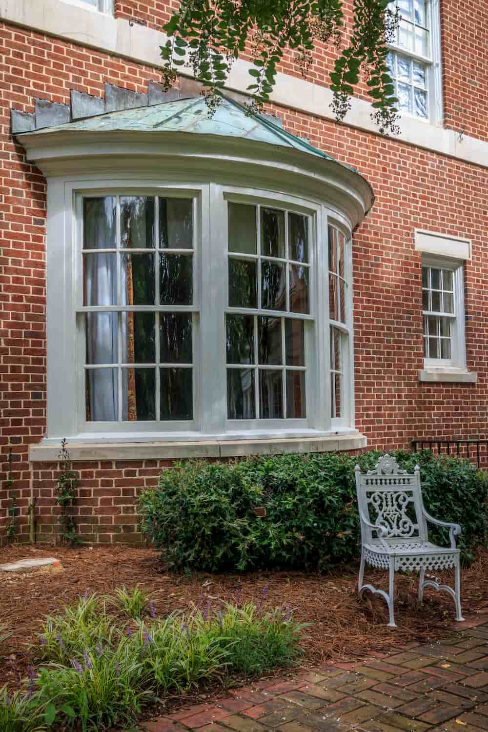 window on a large brick house