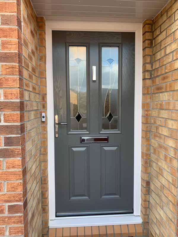 close up of a cream blue door on a modern house